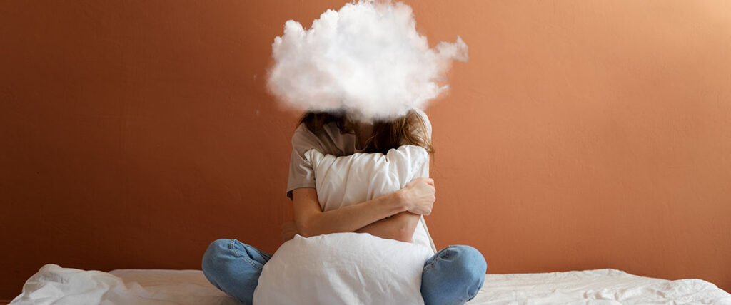 Full shot model posing with cloud-shaped head
