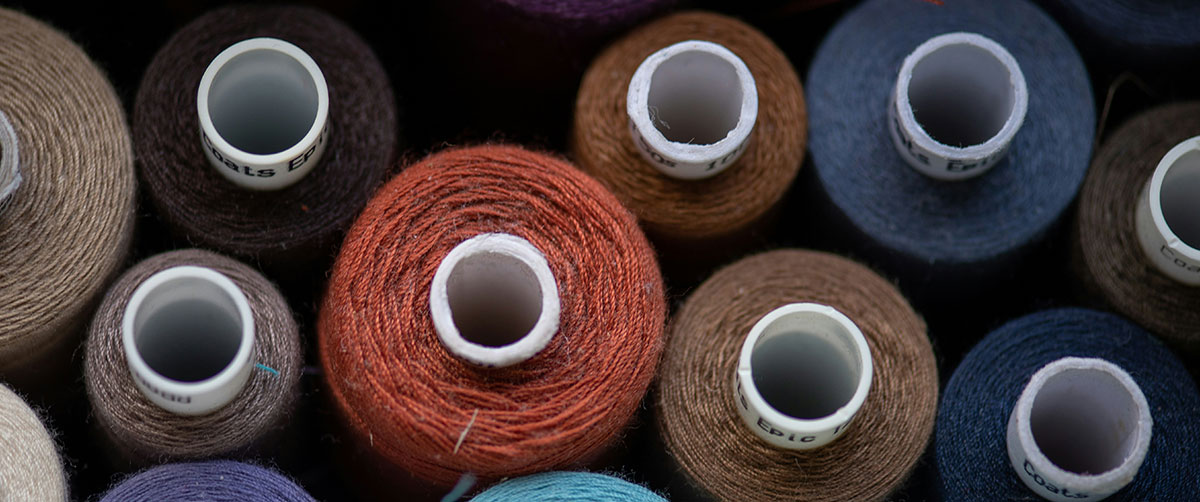 Colorful texture of spools of thread. Photo by Bozhin Karaivanov.