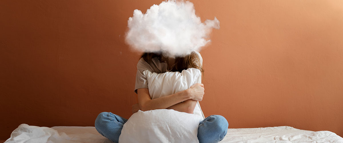 Full shot model posing with cloud-shaped head
